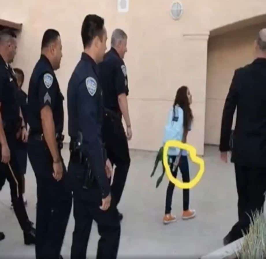 More than 12 police officers appeared in front of her