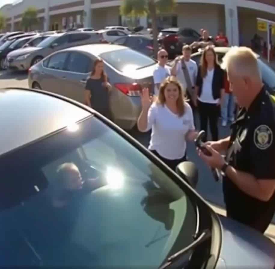 Sunlight bounced off a sea of windshields at the mall parking lot. A baby slept