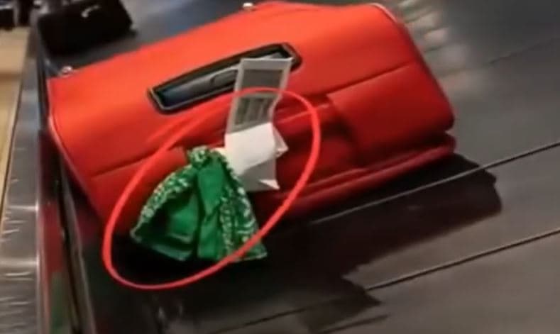 Baggage handler reveals why you should never tie a ribbon on your luggage