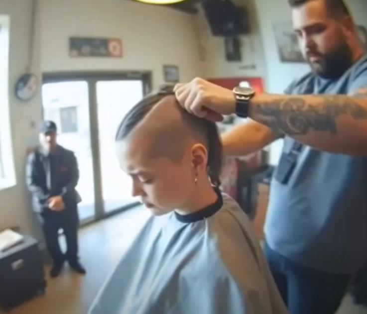 A young woman went to the barbershop to shave off her hair that was falling
